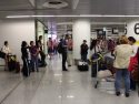 Waiting for luggage at Lisbon International Airport.