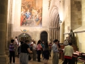 Inside Lisbon Cathedral, in front of St. Vincent tomb. He is being generous by opening his wallet.